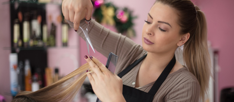 Hairdresser cutting hair